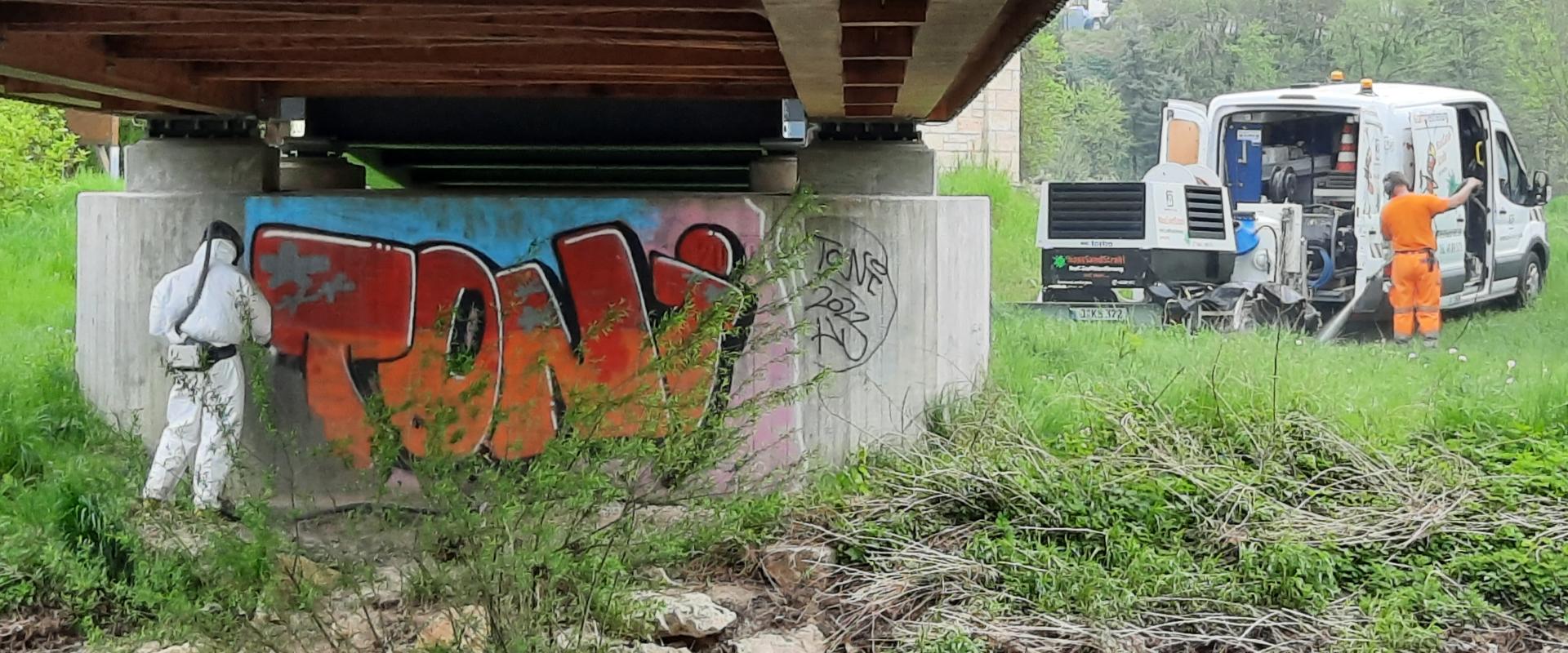 Graffiti removal on the Kunitz house bridge 